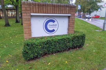Cranfield University's logo on a sign